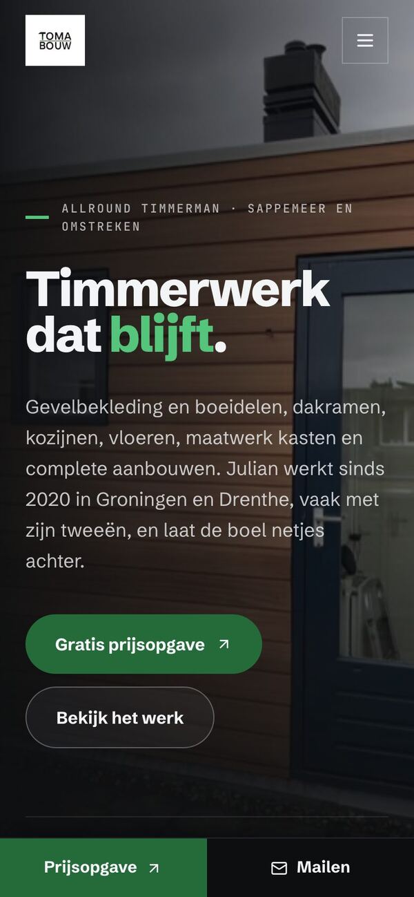 De website van Toma Bouw op een telefoon